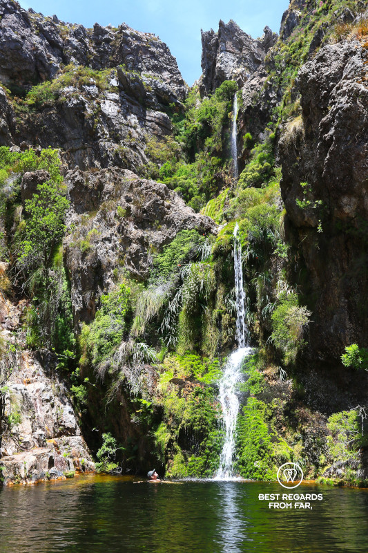 A waterfall falling into a crystal pool on Bobbejaans River in South Africa.