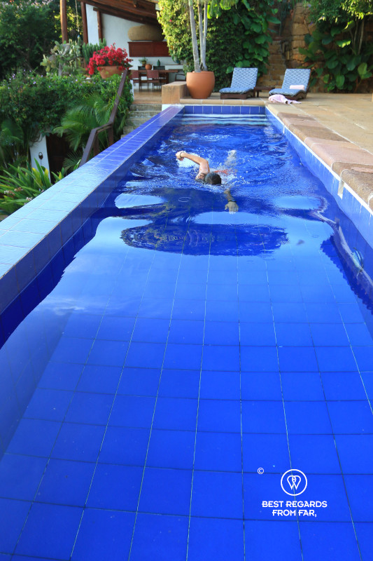 Woman swimming in the pool at Casa Yahri in Barichara.