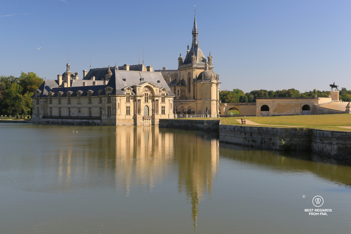 Castle of Chantilly with its reflection in the water.