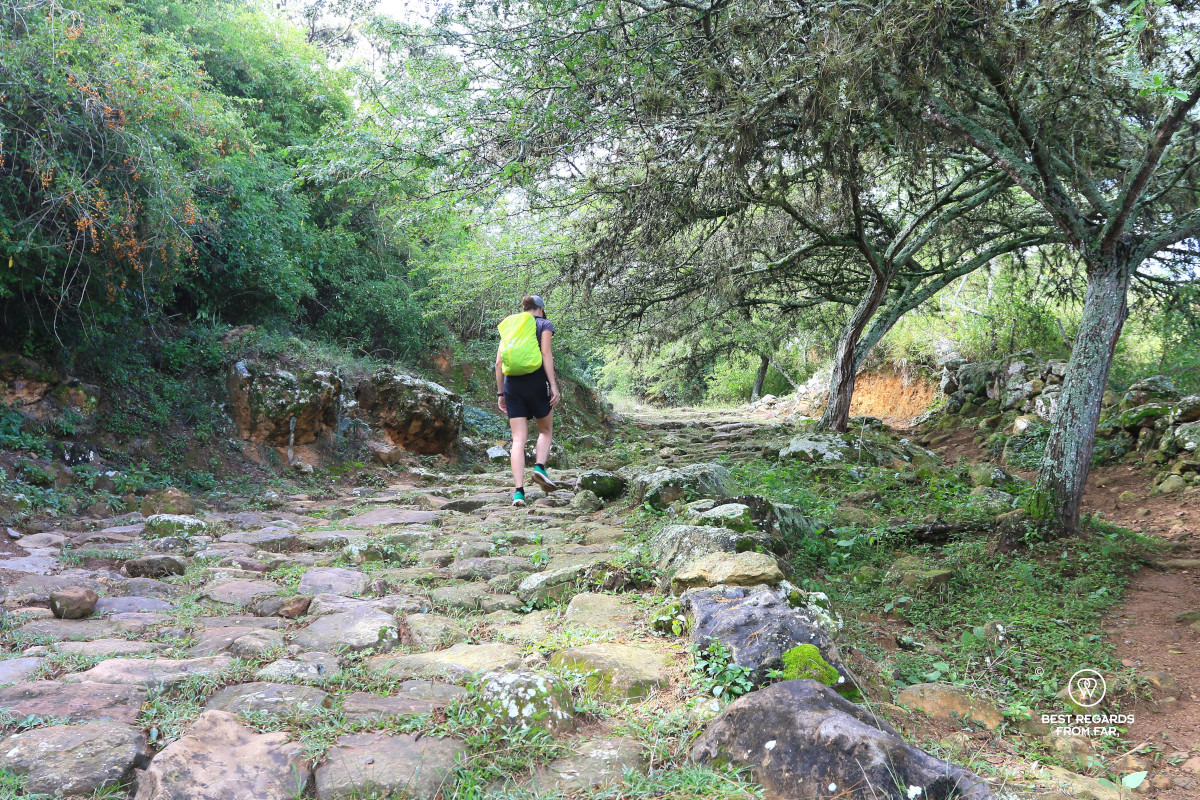 A hiker along the stoned Camino Real from Barichara to Guane in Colombia.