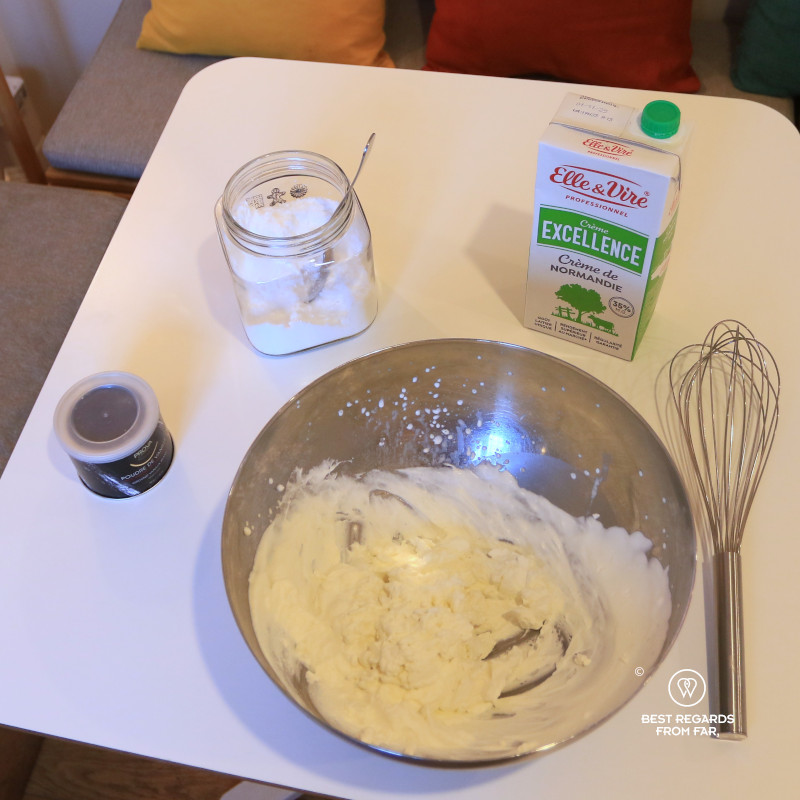 Ingredients to make Chantilly whipped cream on a white table at L'Atelier de la Chantilly.