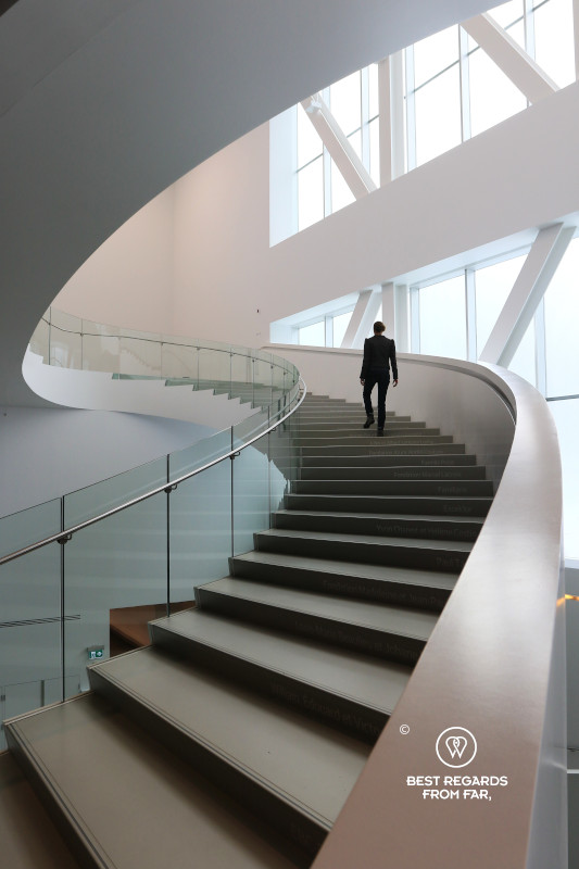 Woman going up the staricase at the Musée des Beaux Arts in Quebec City.