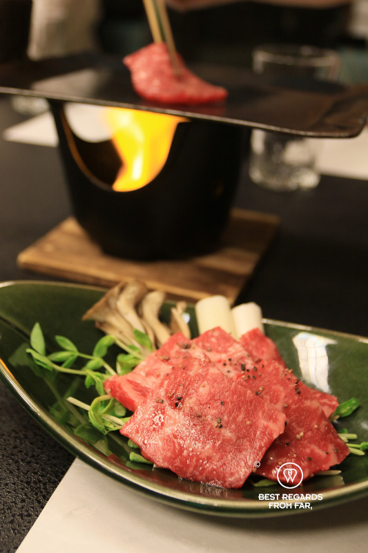 Flaming meat during a kaiseki dinner at Ryokan Sanga in Kurokawa.