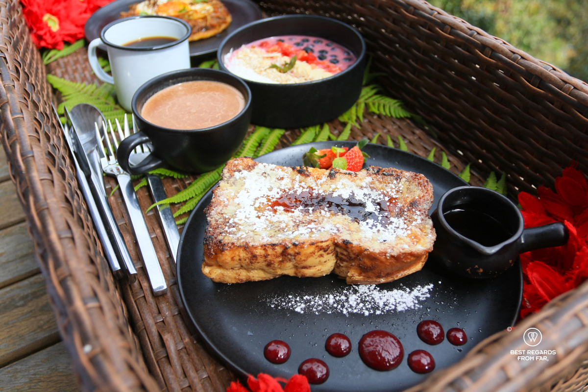 French toasts with hot chocolate, muesli and fruits in a basket for breakfast at Bosko.