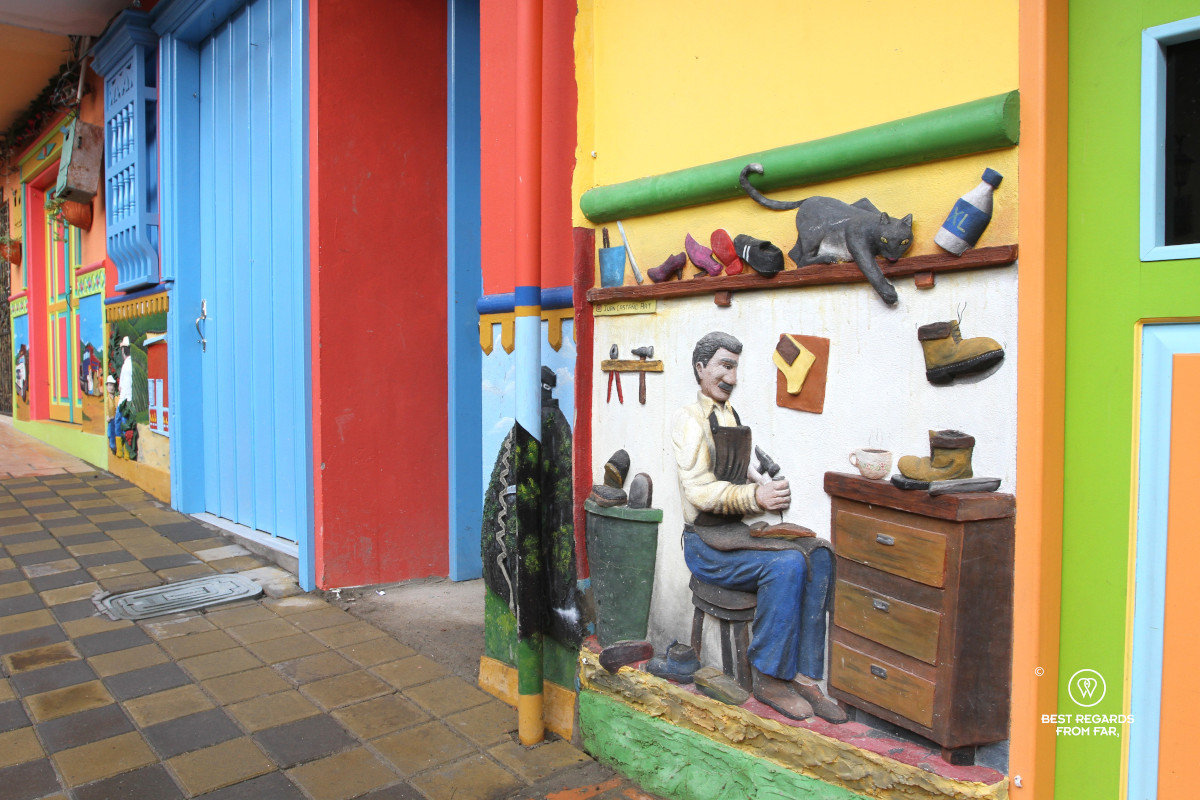 Zocalo murals in Guatape showing a shoemaker.