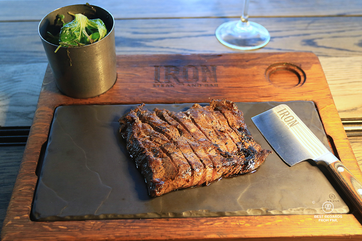 A flat iron steak with a cleaver at Iron Steak and Bar, Cape Town.