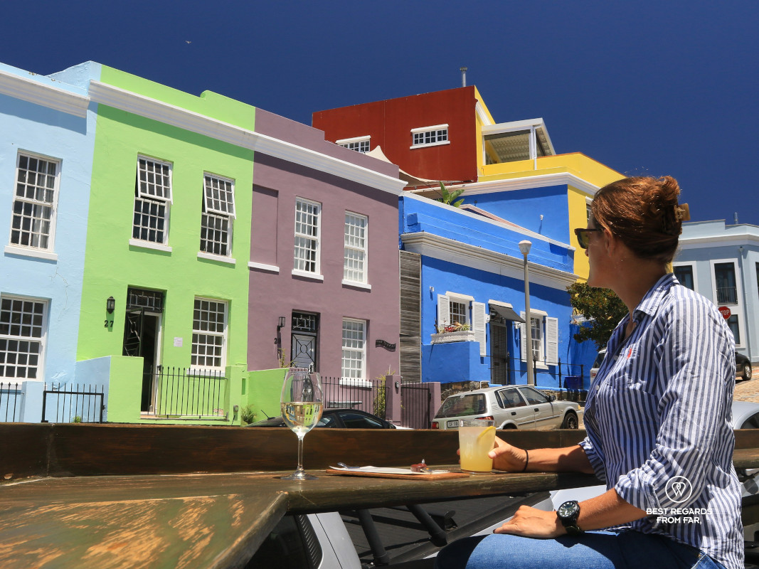 Woman overlooking the colorful houses of De Waterkant from the terrasse of The Melting Pot restaurant in Cape Town.