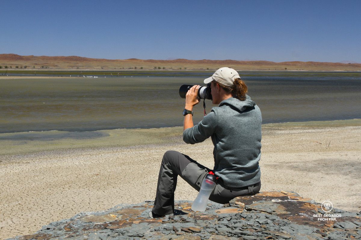 Photographer Marcella van Alphen taking photos of waterbirds at a dam in South Africa.