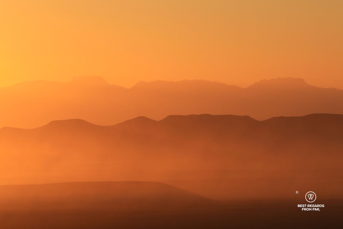 African sunset with layers of mountains and dust in the Tankwa Karoo.