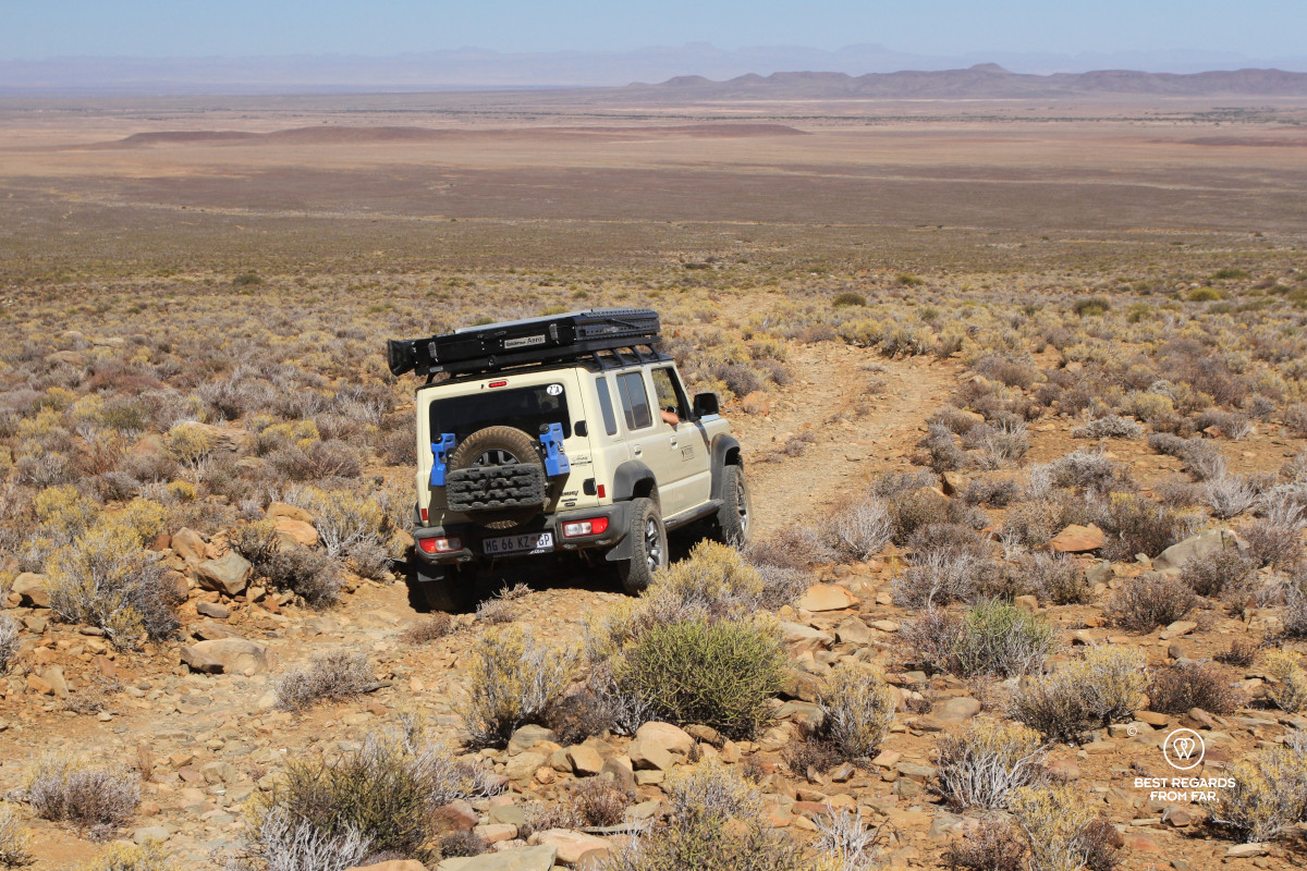 Geared up Suzuki Jimny on a rocky road in the Karoo, South Africa.