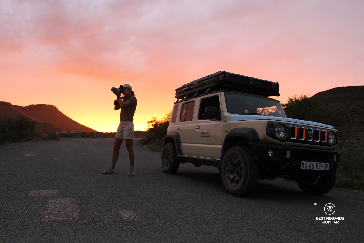 Photographer Marcella van Alphen capturing the sunrise in the Karoo NP by a 4x4.