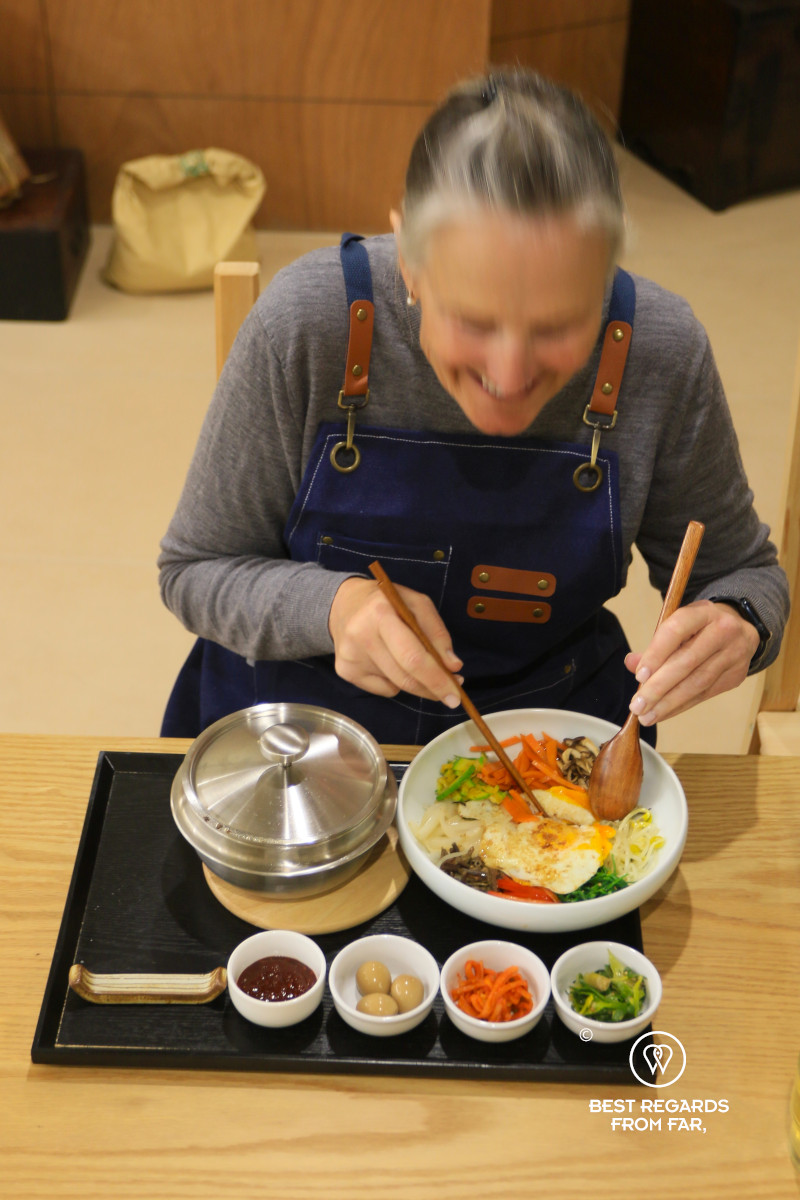 Messing up bibimbap before eating it.