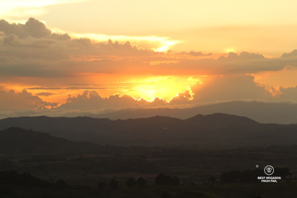 Dramatic sunset with large clouds above the mountains.