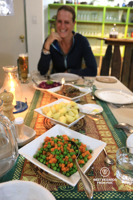 Home-cooked meal with vegetables, potatoes, meat and salad presented on a table at BuellsPort Lodge & Farm.