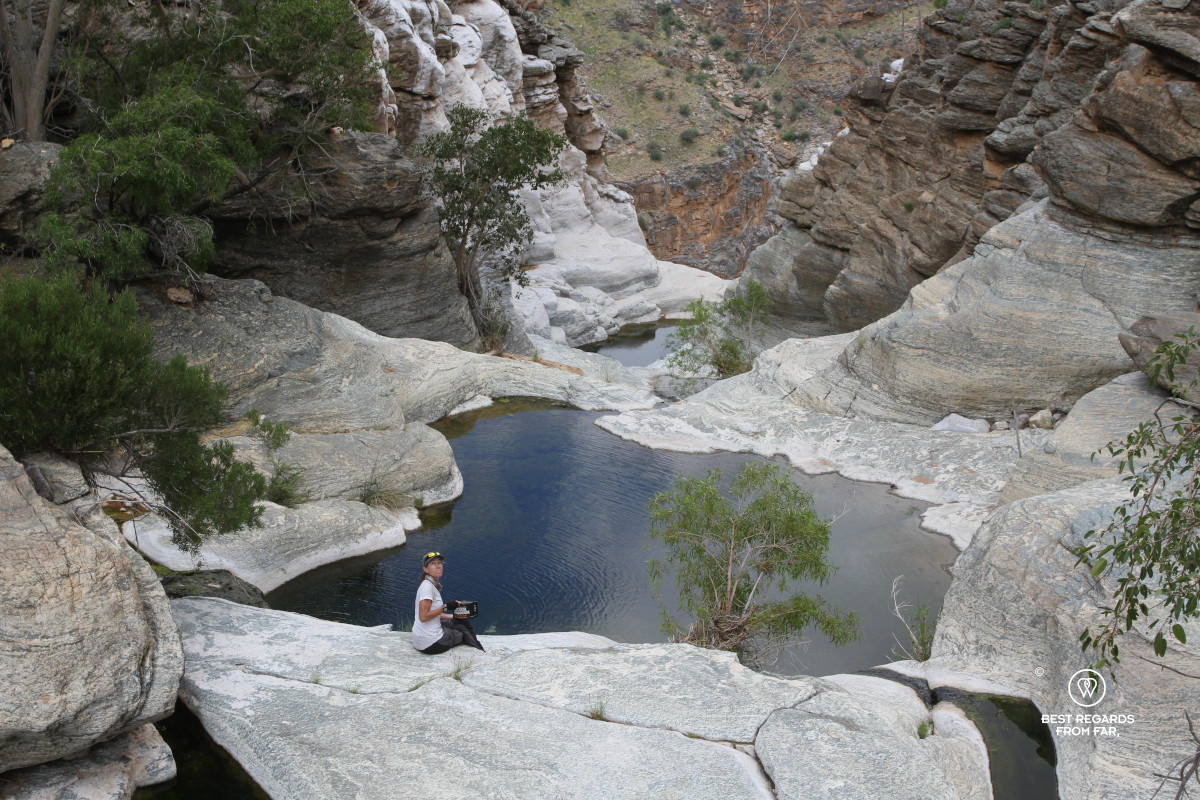 Author Claire Lessiau enjoying a tactical foodpack breakfast by the rock pool at the top of the waterfall.