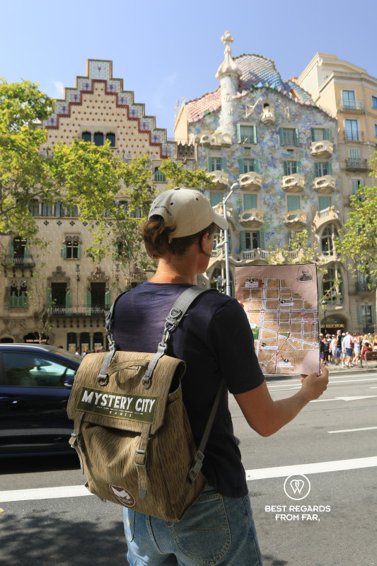 Solving a treasure hunt in front of Casa Batllo in Barcelona.