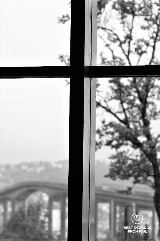 Black and white photo from inside the Arctic Cathedral of Tromso showing a cross.