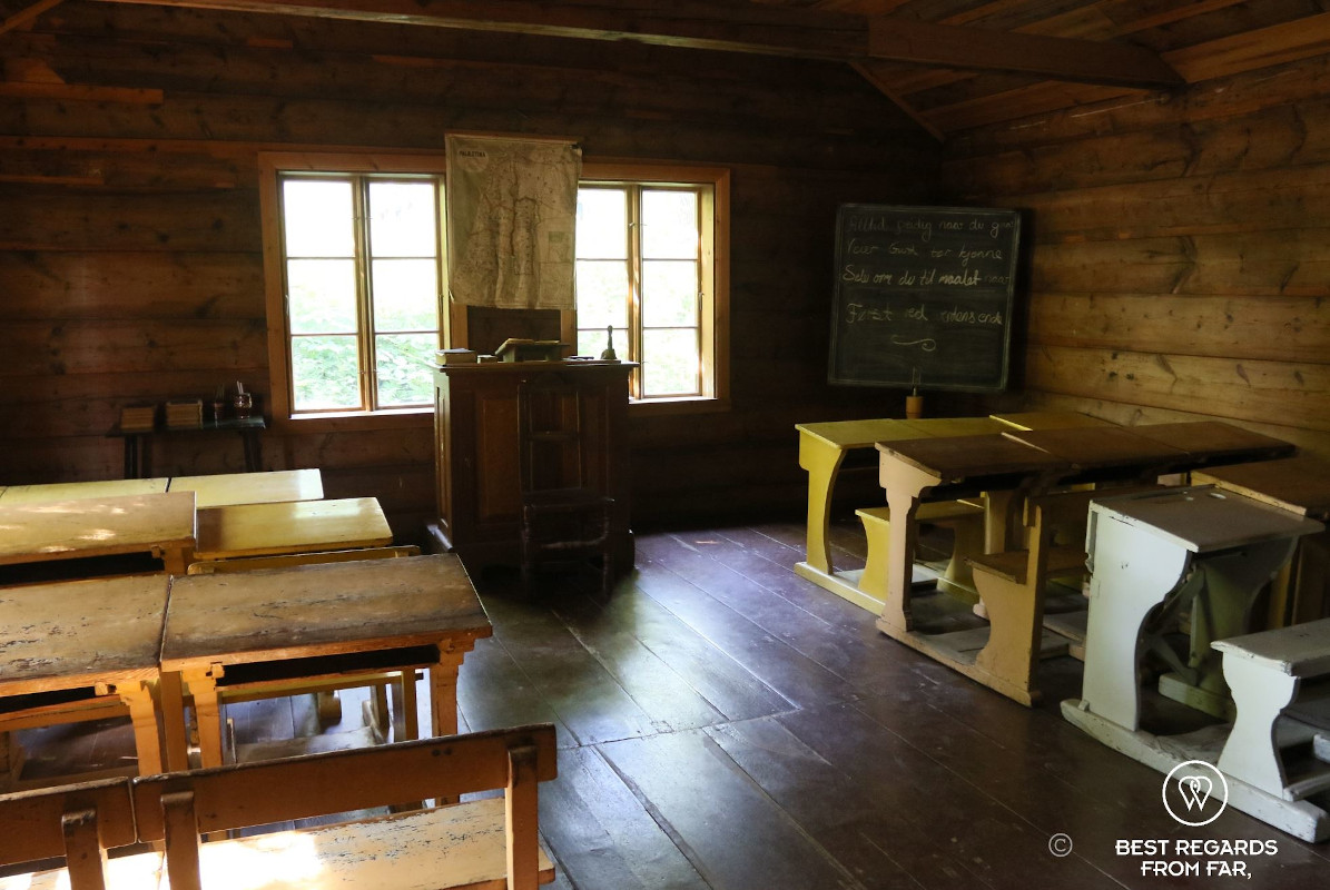 Wooden benches and tables in an old wooden school in Oslo.