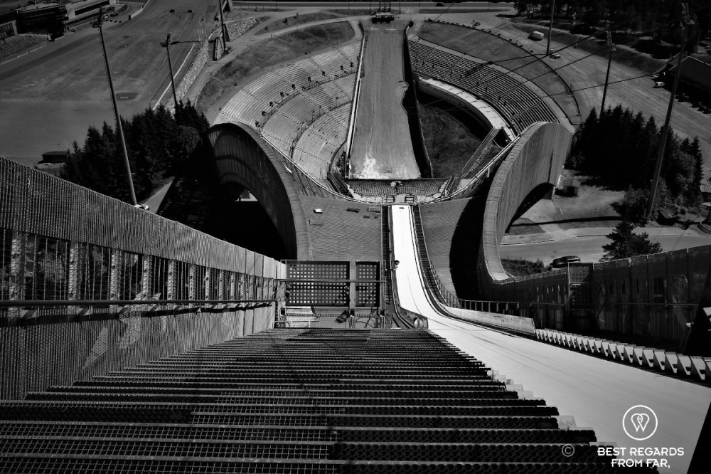 Black and white photo of the ski jump ramp seen from above in Oslo.