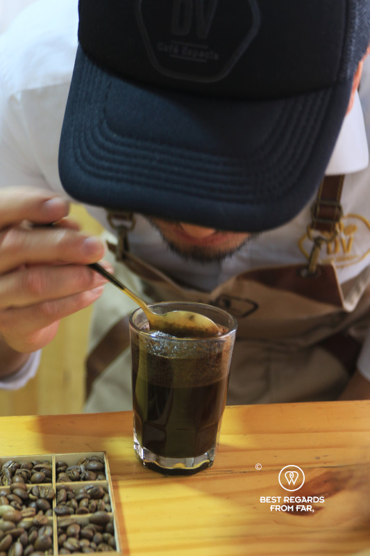 Man taking in the aromas of coffee.