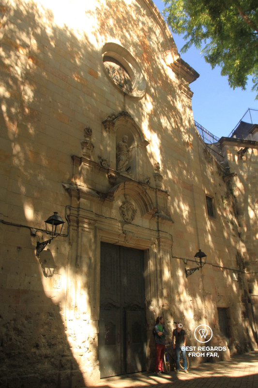 Façade on the Plaza San Felipe Neri in Barcelona with indents of bombs of the Civil War.