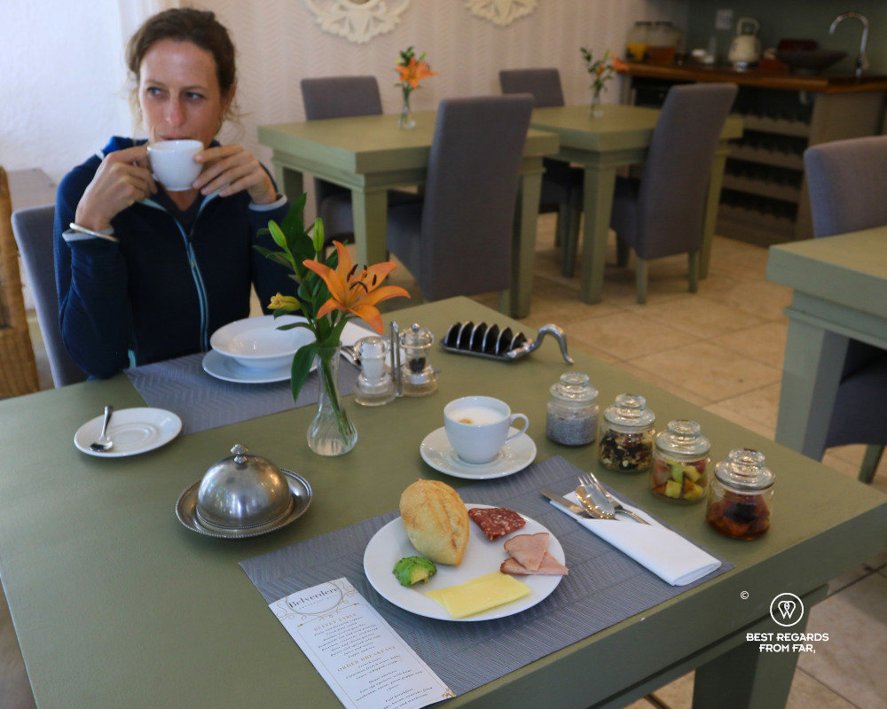 Woman having breakfast at The Belvedere Boutique Hotel in Windhoek, Namibia.